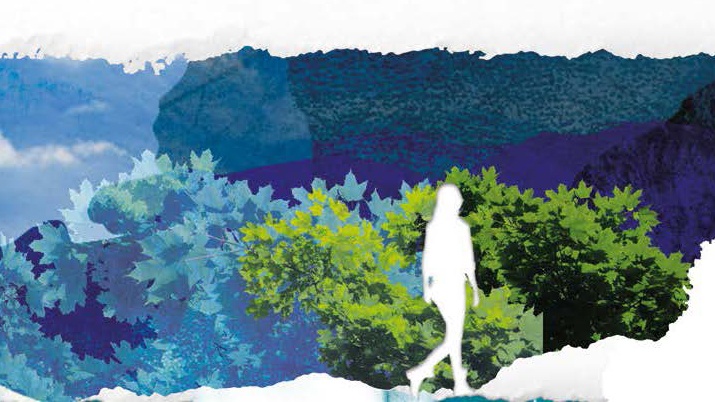 The outlines of a human figure in white walks in front of a landscape